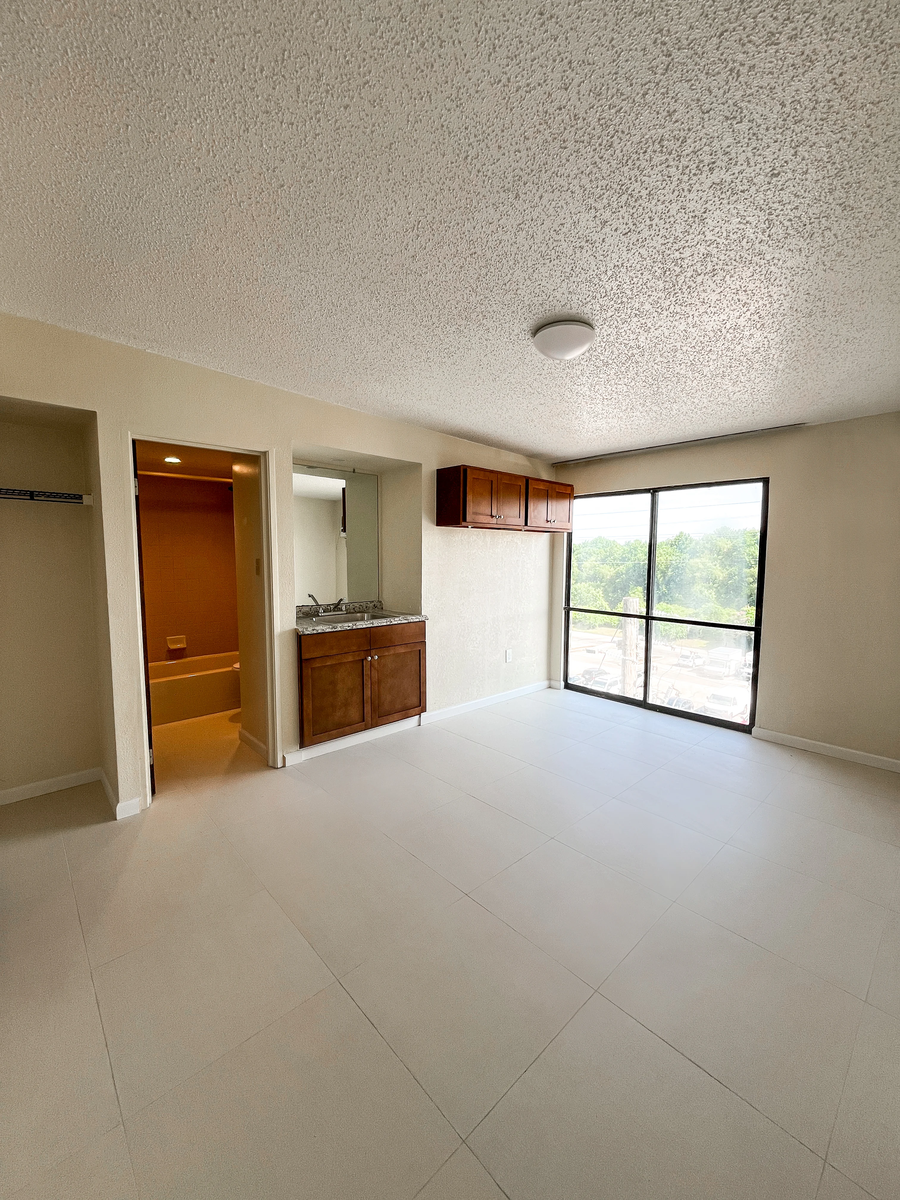 Bright apartment living space with large window
